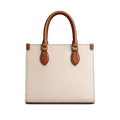 Beige handbag with brown handles and straps on a white background
