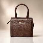 Brown textured handbag on a beige background