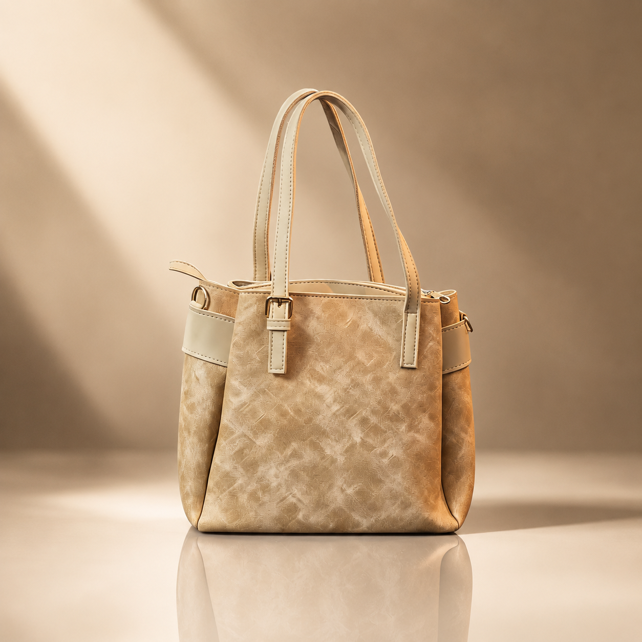 Beige handbag with leather accents on a beige background