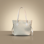 White handbag on a beige background